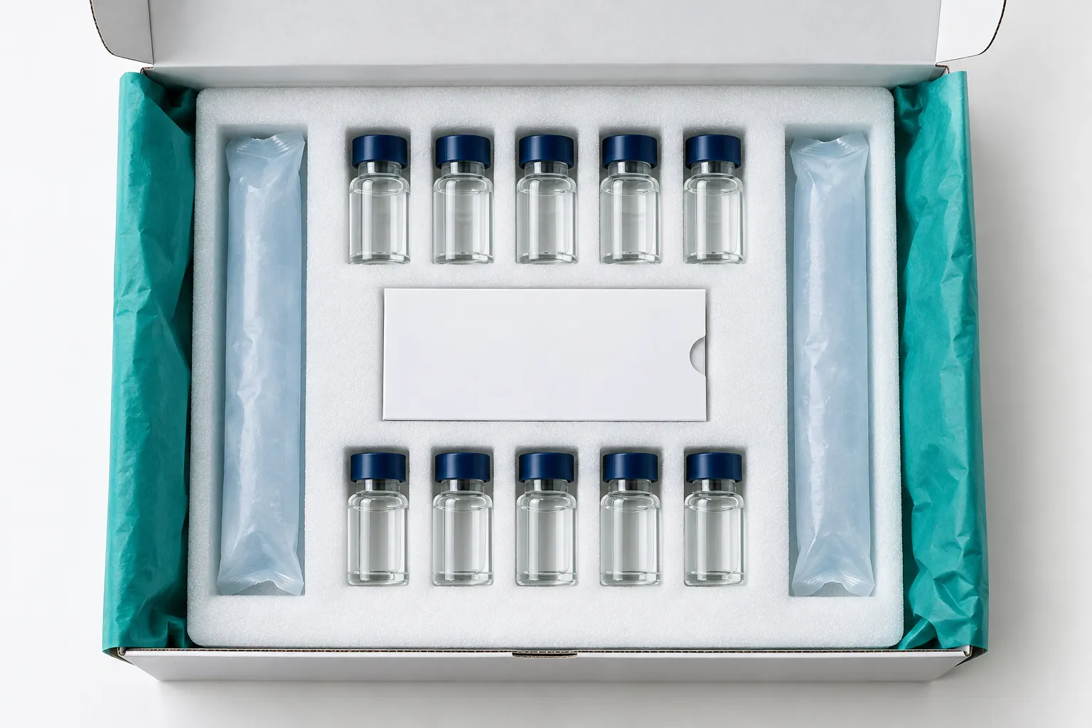Insulated shipping box with sealed vials in a foam insert and cold packs